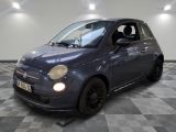 la photo d'une petite voiture bleue garée dans un garage