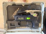 a black and white corded sander in a box