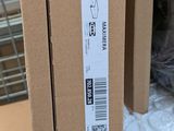 a cardboard box with a sticker on it sitting on a table