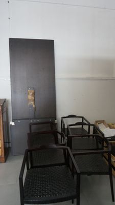 many chairs and a table in a room