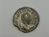 a silver coin with an image of a man on it