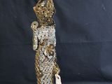an image of a statue of a man made out of coins