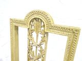 a picture of a gold chair with a picture frame on the back