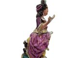 an image of a figurine of a woman sitting on a chair