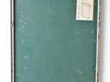 a picture of a green board on a white wall