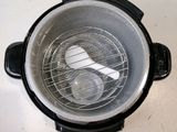 an overhead view of an air fryer with a basket of food inside of it
