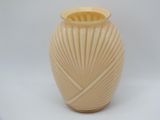 a white vase with a yellow top on a white background