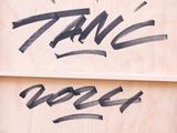 a wooden box with graffiti written on it and a skateboard