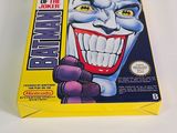 the box for the game batman returns is shown on a white surface