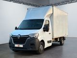 une camionnette blanche garée à l'intérieur d'un bâtiment