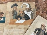 plusieurs vieux livres, sur lesquels figurent des photos de personnes, posés sur une table