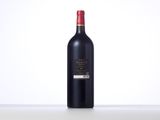 a bottle of red wine sitting on top of a table