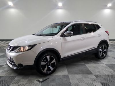the white nissan suv is parked on a checkered tile floor