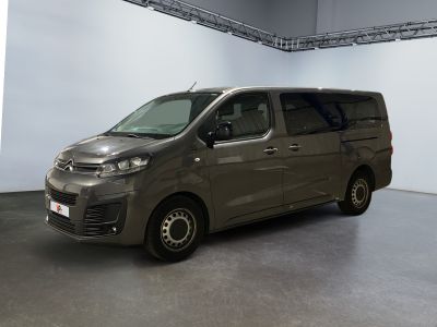 the van is parked in the large room of the building
