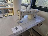 a sewing machine sitting on a table in a room