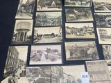 several black and white photographs of old buildings on a table