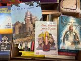 a lot of books that are sitting on a table