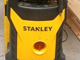 a yellow and black power washer sitting on the ground