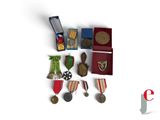 a small collection of medals and medals on a table