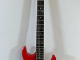 an electric guitar sitting on top of a white surface