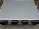 an image of a metal box with four black exhaust pipes