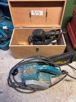 a box with tools in it sitting on the floor