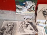 many pictures of a woman sitting on the floor