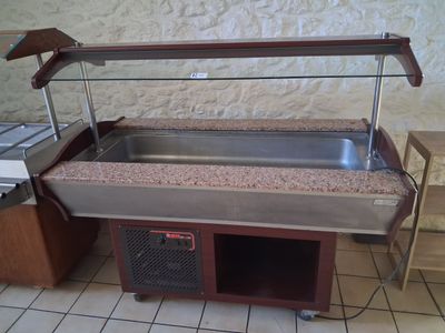 a buffet table with a sink and a counter with a counter top
