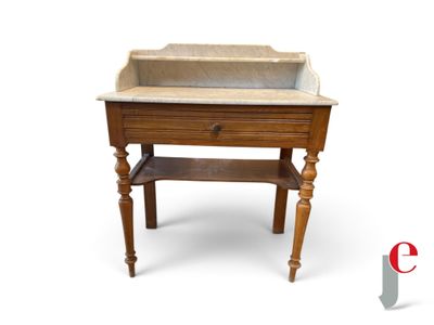 a wooden sink with a marble top on a table