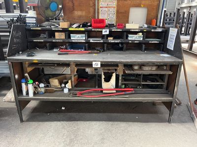 a workbench with a lot of tools on it