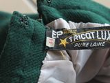 a close up of a green jacket with a label on it