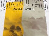 united world wide t - shirt in white with yellow and grey clouds