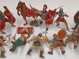 a lot of figurines that are sitting on a table