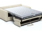 an image of a sofa bed with a mattress attached to it