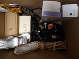 a box full of shoes and other items in it