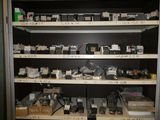 many electronic devices on the shelves in the room