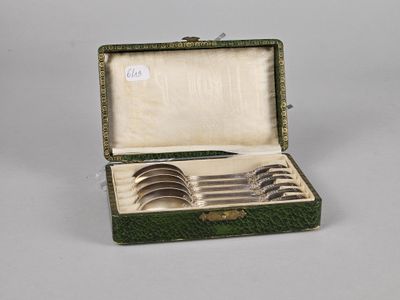 silverware in a green case with a handle and four spoons