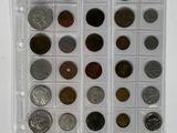 a lot of coins in a plastic case on the table