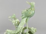 pair of chinese green glazed porcelain birds on a stand