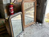 two mirrors on the ground next to a fire extinguisher