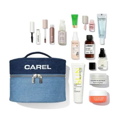 the contents of a travel bag are laid out on a white surface