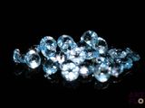 some very pretty blue diamonds on a black surface
