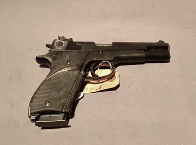 a gun that is laying on a table