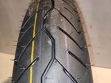 a close up of a motorcycle tire with a yellow line on it