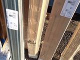 several pieces of wood are stacked next to each other on the ground