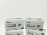 three boxes of face mask on a white background