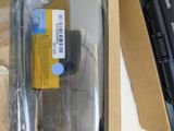 a box with a laptop and a battery inside of it