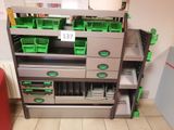 a metal cabinet with green bins on top of it