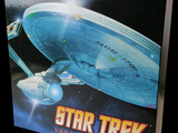 a box with a model of a star trek ship on it