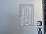 a close up of a laptop computer with a hard drive attached to it